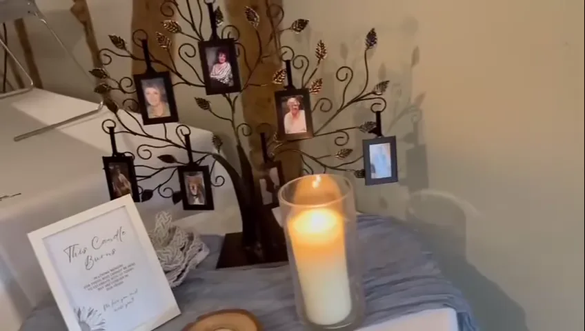 Memory tree with family photos and a candle